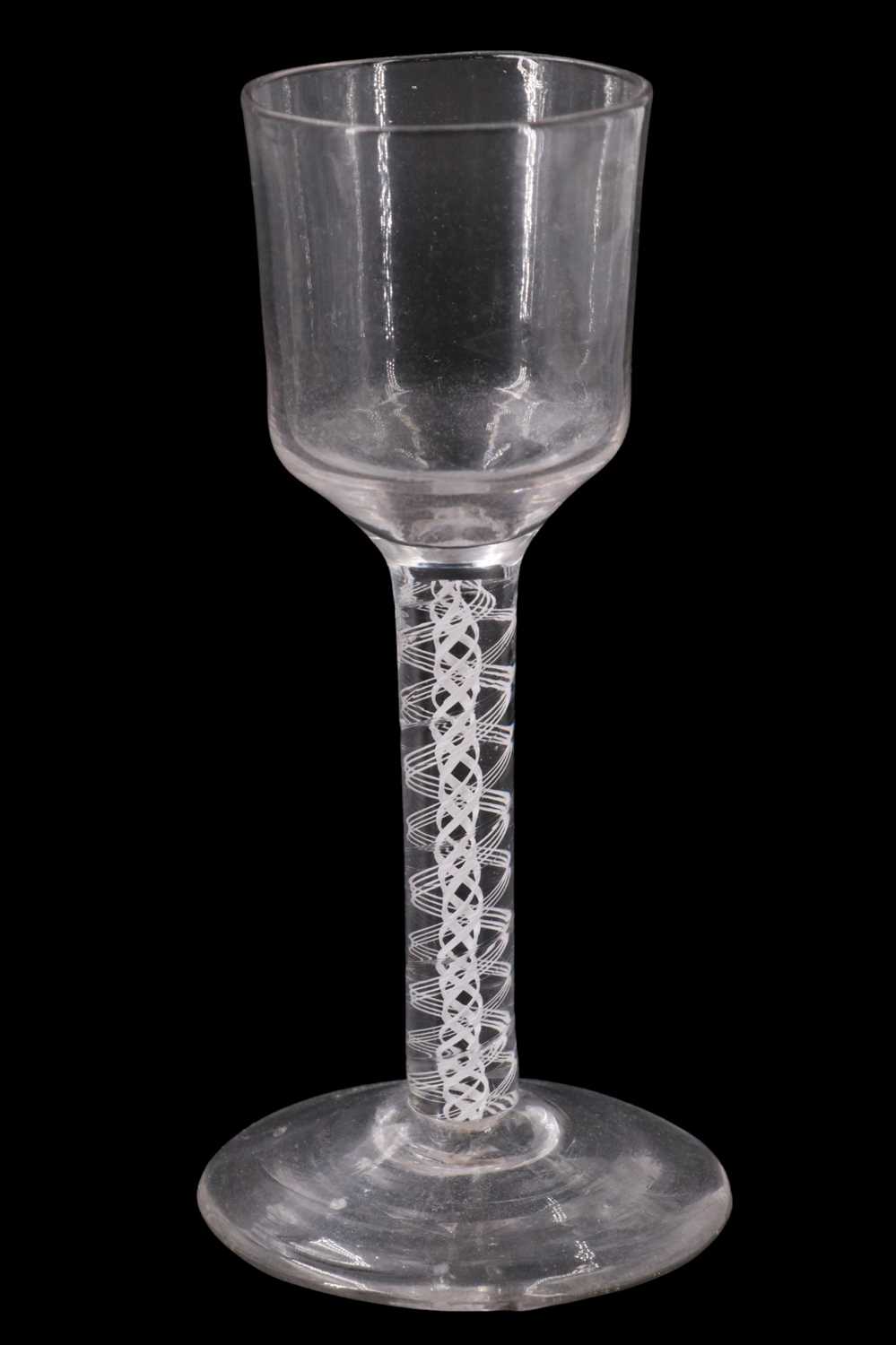 Lot 1372 - A mid 18th Century opaque twist stemmed wine...