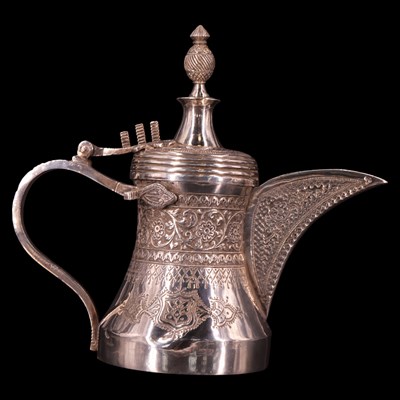 Lot 1177 - A Middle Eastern white metal dallah coffee pot,...