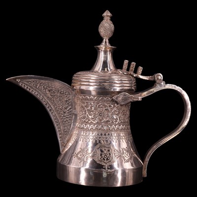 Lot 1177 - A Middle Eastern white metal dallah coffee pot,...