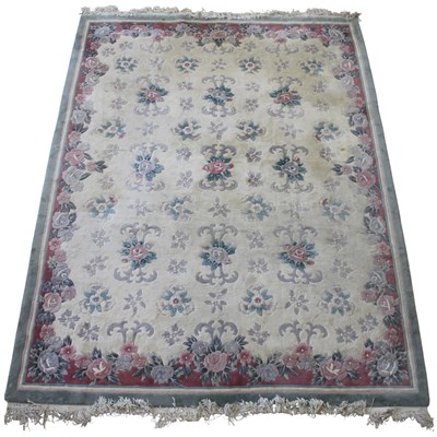 Lot 1662 - A large floral pattern wool-pile carpet, 380...