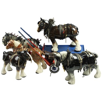 Lot 1017 - Five ceramic Clydesdale Shire horses, together...