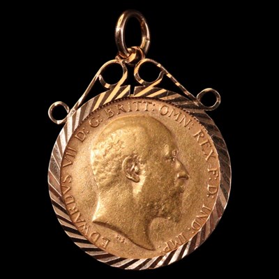 Lot 1311 - A 1907 gold half-sovereign coin in a 9 ct gold...