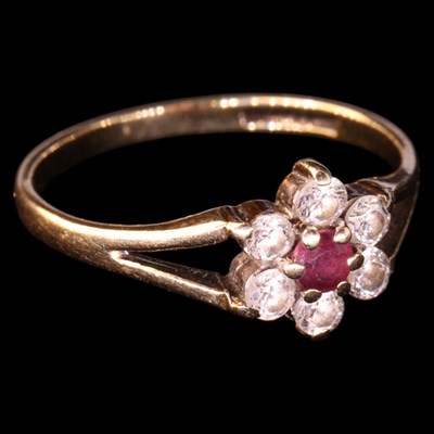 Lot 1320 - A 1980s ruby and cubic zirconia flowerhead...