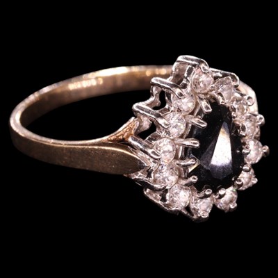 Lot 1322 - A 1980s sapphire and white gemstone cluster...