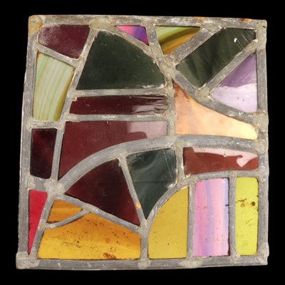 Lot 1099 - A small square-shaped stained glass panel, 26...