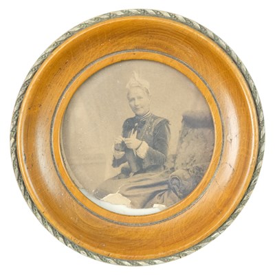 Lot 921 - A late Victorian treen round photograph...