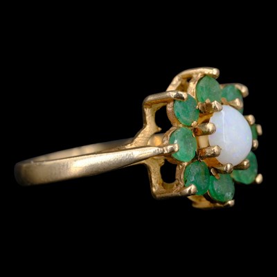 Lot 1343 - A 1970s opal and emerald flowerhead cluster...