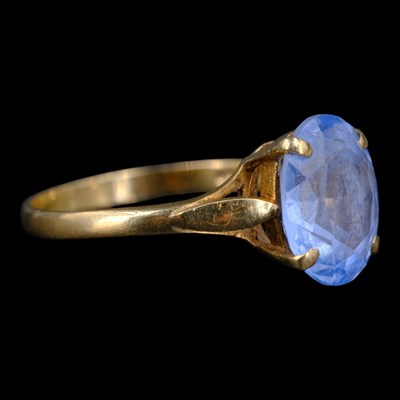 Lot 1345 - A 1980s blue-topaz solitaire ring, comprising...