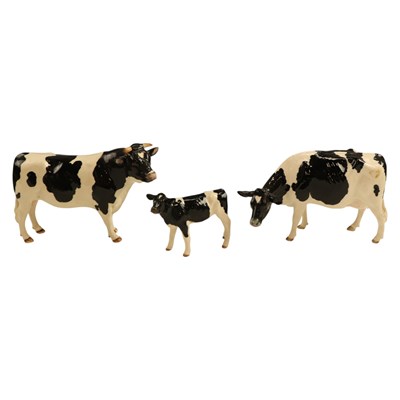 Lot 1073 - A Border Fine Arts "Friesian bull", together...