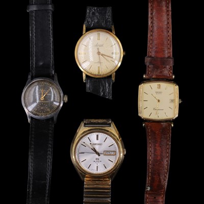 Lot 1580 - A group of four vintage wristwatches,...