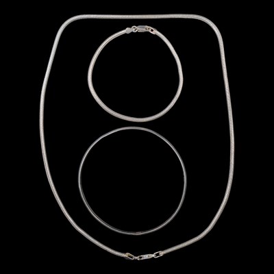 Lot 1278 - A silver bangle together with a silver...