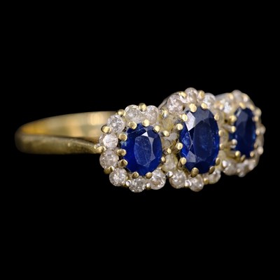 Lot 1420 - A vintage sapphire and diamond triple cluster...