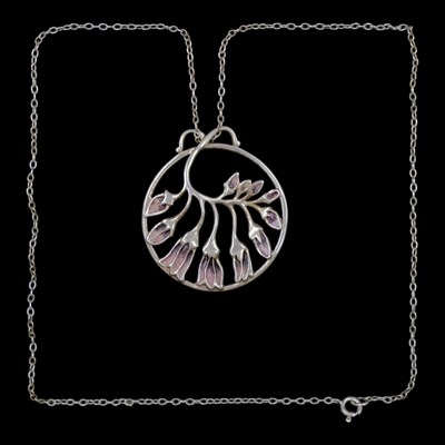 Lot 1306 - A Scottish Art Nouveau influenced enamelled...