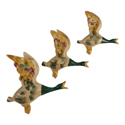 Lot 974 - A set of three mid 20th Century flying duck...