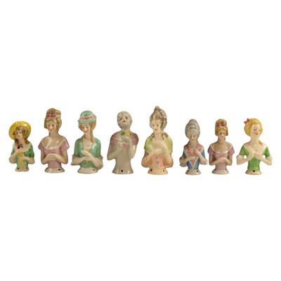 Lot 848 - Eight German porcelain pin cushion...
