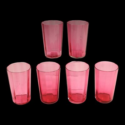 Lot 1110 - A set of six cranberry glass beakers, circa...