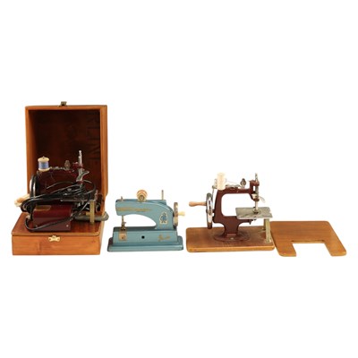 Lot 862 - Two Essex miniature sewing machines, together...