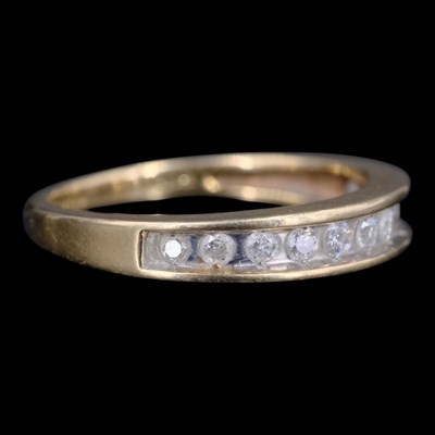 Lot 1424 - A near-contemporary diamond half-hoop eternity...