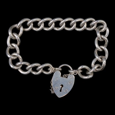 Lot 1282 - A 1970s silver curb-link bracelet having a...