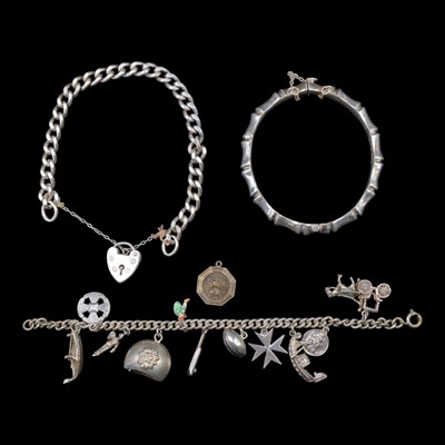 Lot 1279 - A 1960s silver curb-link bracelet having a...