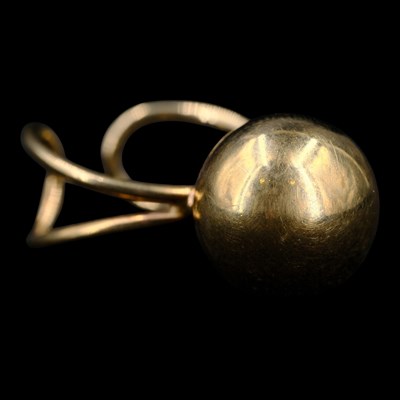 Lot 1399 - A 1970s Modernist 9 ct gold ring, comprising a...