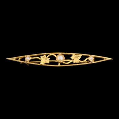 Lot 1403 - A vintage seed-pearl and yellow metal navette...