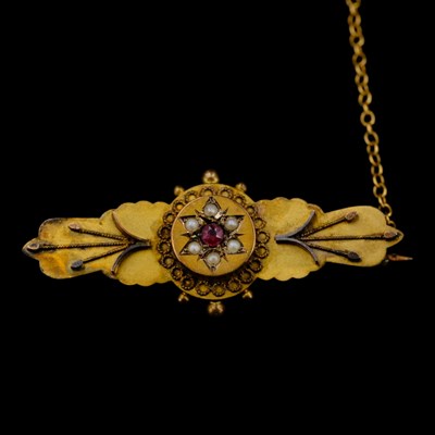 Lot 1447 - An Edwardian almandine, seed-pearl and 9 ct...
