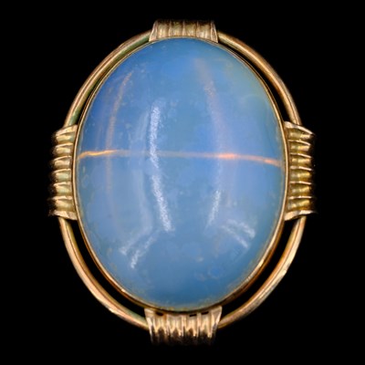 Lot 1454 - A large faux-moonstone and 9 ct yellow metal...