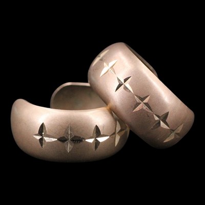 Lot 1457 - A pair of 1970s 9 ct gold hoop earrings, each...