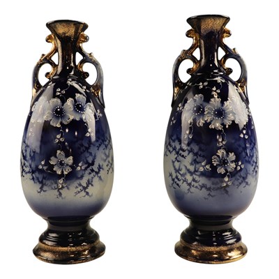 Lot 989 - A pair of European continental flow-blue vases,...