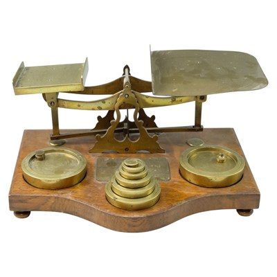 Lot 733 - A set of large oak and brass postal balance...