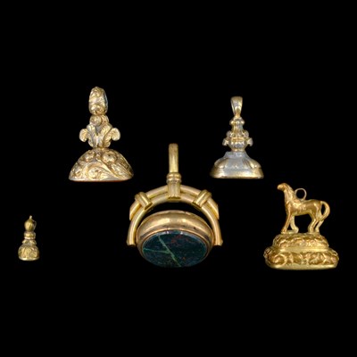 Lot 1534 - Five 19th Century gilt-metal fob seals,...
