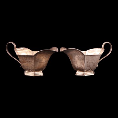 Lot 1188 - A pair of George V Art Deco influenced silver...