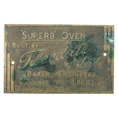 Lot 906 - An early-to-mid 20th Century brass plaque for...