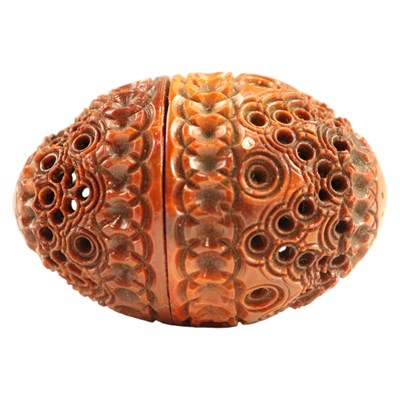 Lot 871 - A Georgian carved coquilla nut pocket pomander...
