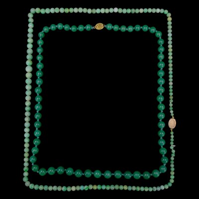 Lot 1498 - Two nephrite / jadeite bead necklaces,...