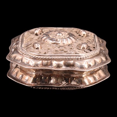 Lot 1193 - A small Dutch white metal hinge-lidded...
