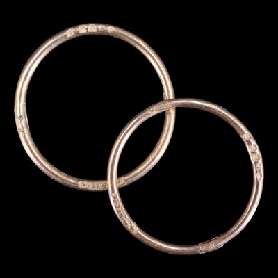Lot 1504 - A pair of 1920s 9 ct gold sleeper hoop...