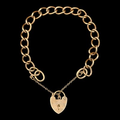 Lot 1410 - A 1970s 9 ct gold curb-link bracelet having a...