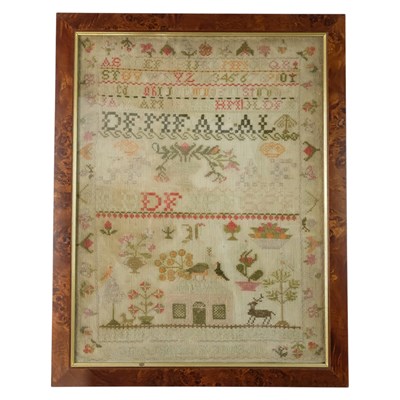 Lot 856 - A Victorian needlework alphabet sampler, being...