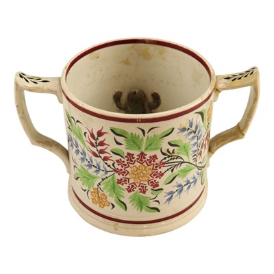 Lot 1003 - A Victorian frog loving cup, (a/f), 13 cm