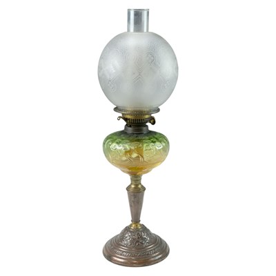 Lot 920 - A copper and brass oil lamp, having a pressed...
