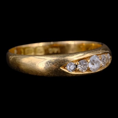 Lot 1522 - A diamond and 18 ct gold ring, comprising five...
