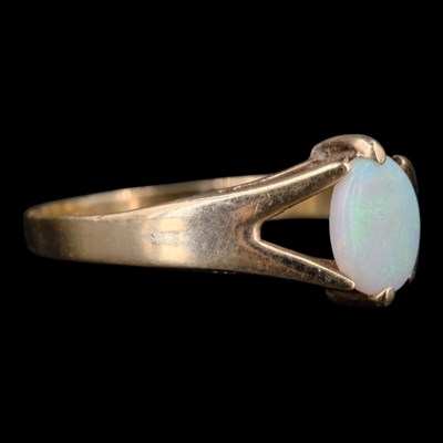 Lot 1523 - A 1970s opal ring, comprising an oval opal...