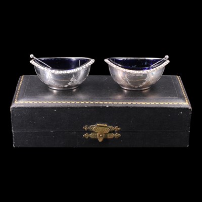 Lot 1215 - A cased pair of 1920s silver salt cellars and...