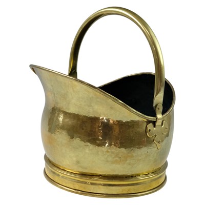 Lot 919 - A brass coal helmet, 36 cm to top of raised...