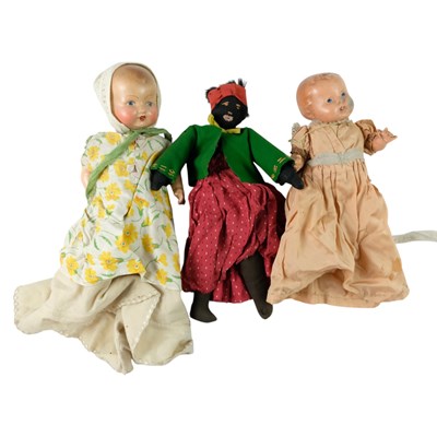 Lot 832 - A vintage black cloth doll, together with two...