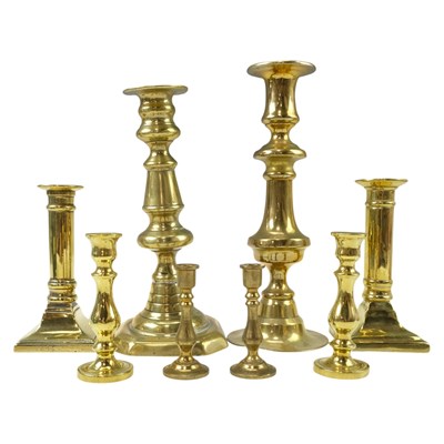 Lot 914 - A quantity of brass candlesticks, tallest 22 cm