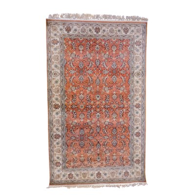 Lot 1666 - A Persian hand-knotted silk rug, having...