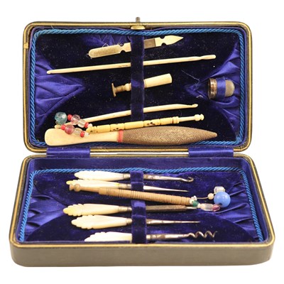 Lot 851 - A Victorian sewing / grooming case, together...